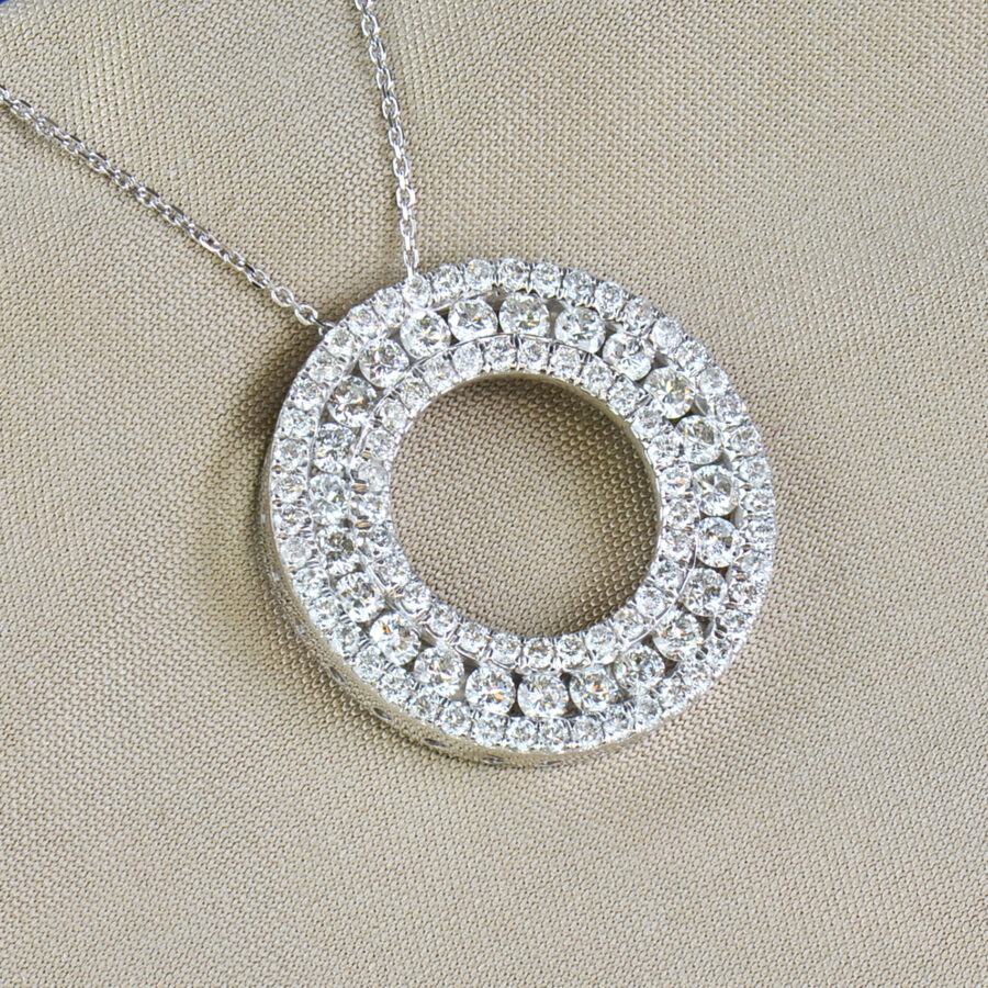 round cut diamond and white gold circle pendant