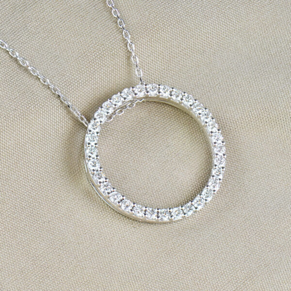 Round diamond and white gold circle pendant and chain
