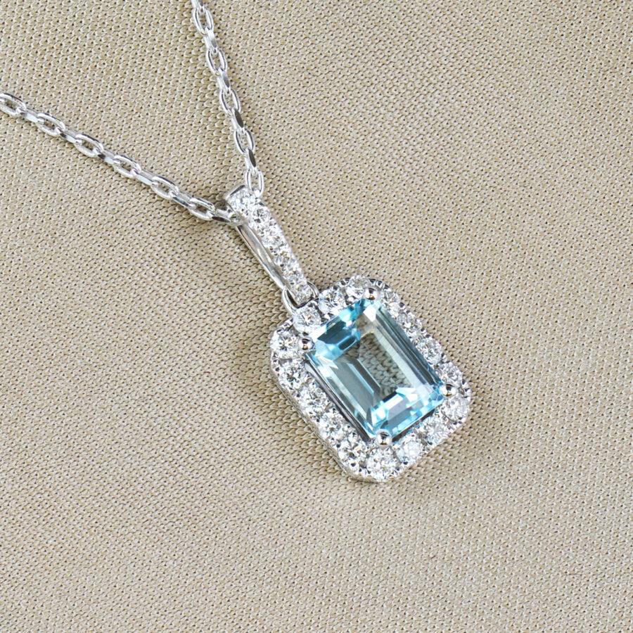 Blue topaz and diamond cluster pendant