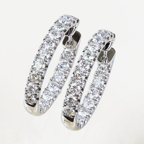 White gold and round brilliant cut diamond hoop earrings