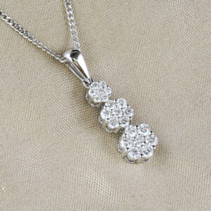 round cut diamonds and white gold cluster pendant