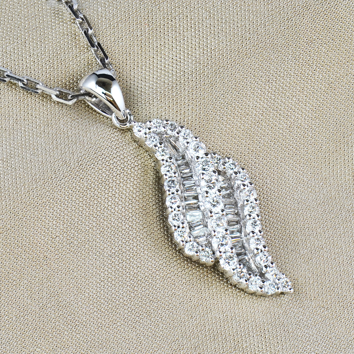 Round and baguette cut diamond pendant and chain