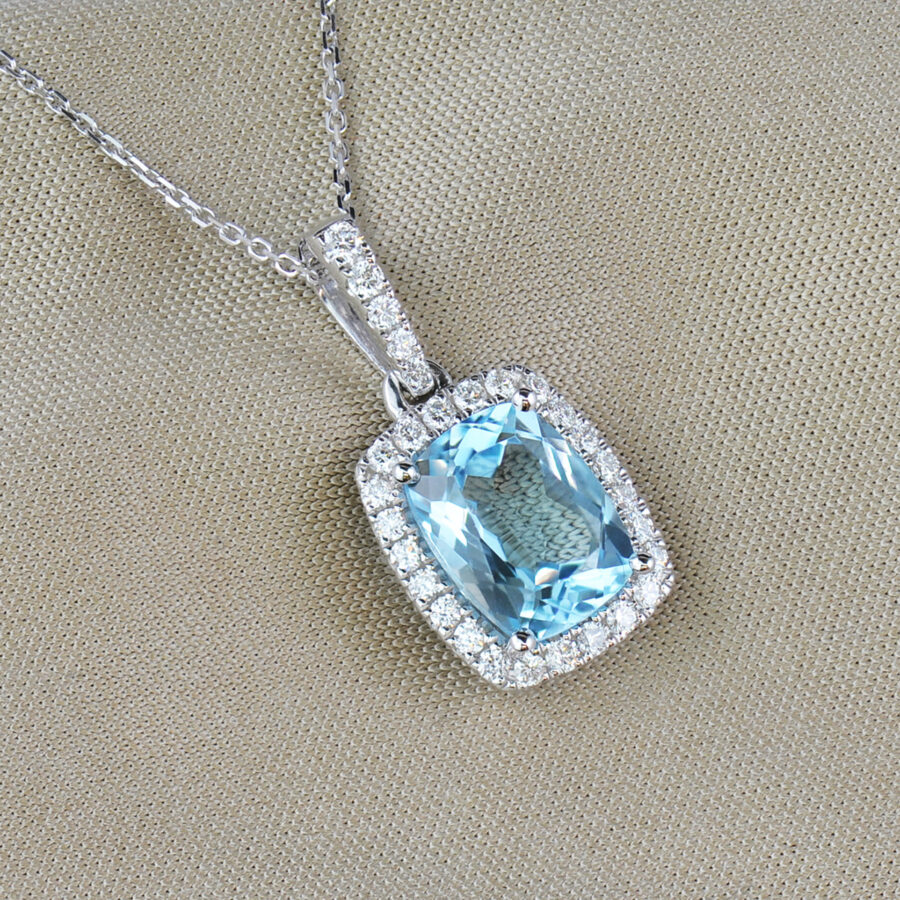Blue topaz and diamond cluster pendant