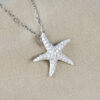 white gold and diamond star fish pendant