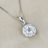 round cut diamond and white gold cluster pendant