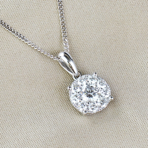 round cut diamond and white gold cluster pendant