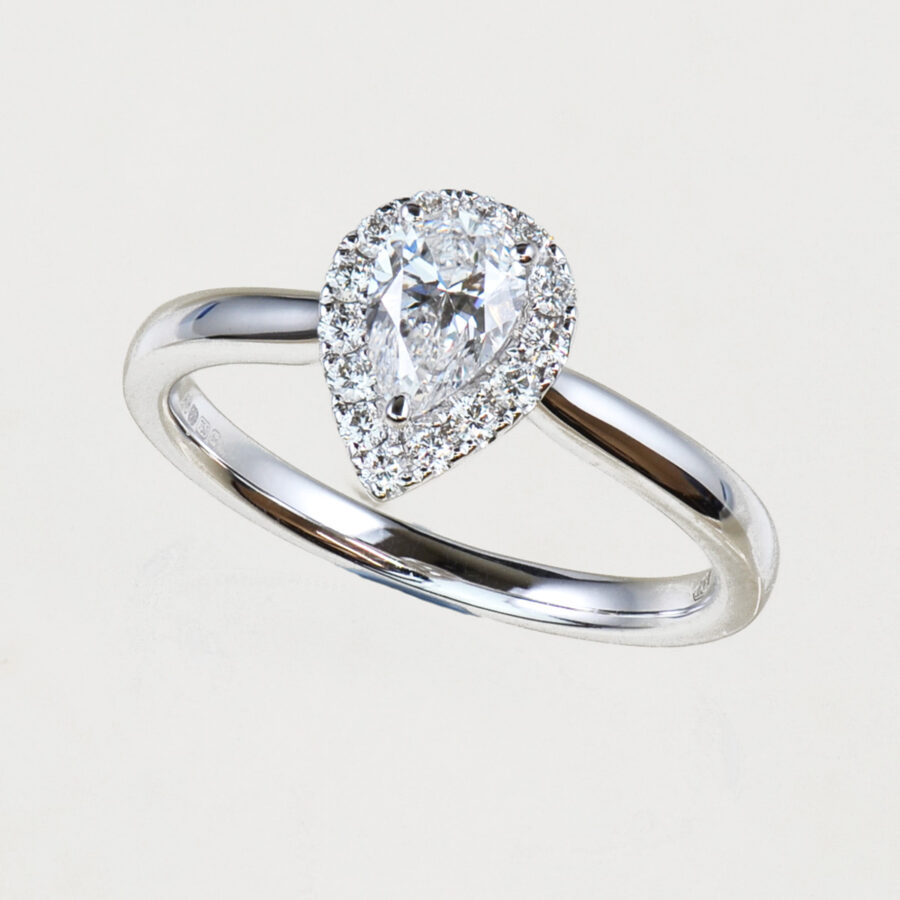 Pear shape diamond halo engagement ring
