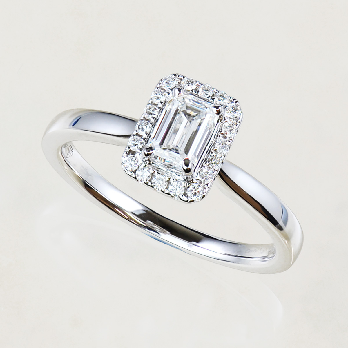 emerald cut diamond halo ring