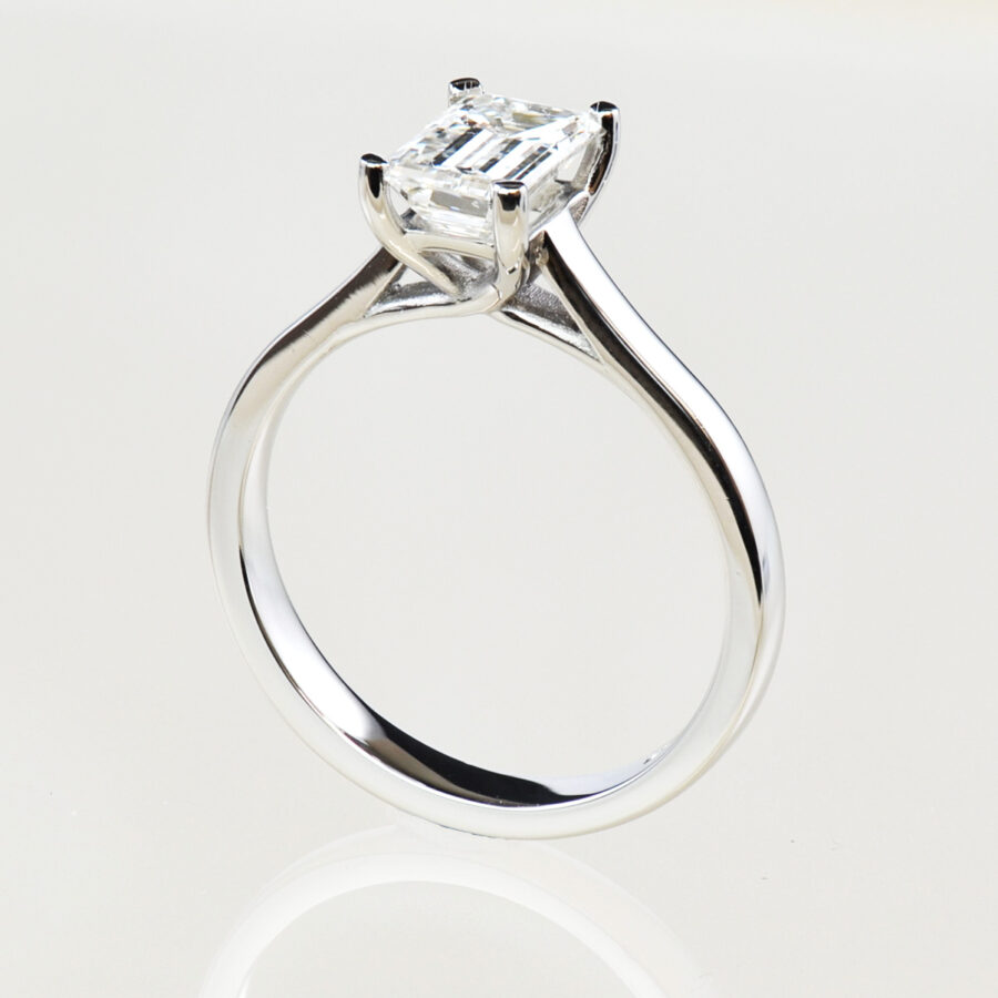 1.14 carat emerald cut diamond set in a 4 claw platinum setting