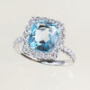 cushion cut blue topaz and natural round brilliant cut diamond cluster ring
